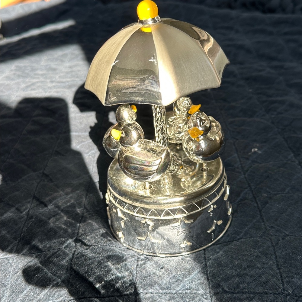 Reed & Barton “Something Duckie” musical duck carousel - silver plated